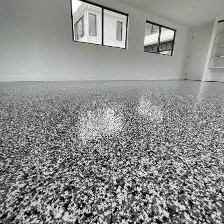 Grey and white flake epoxy floor in a finished room